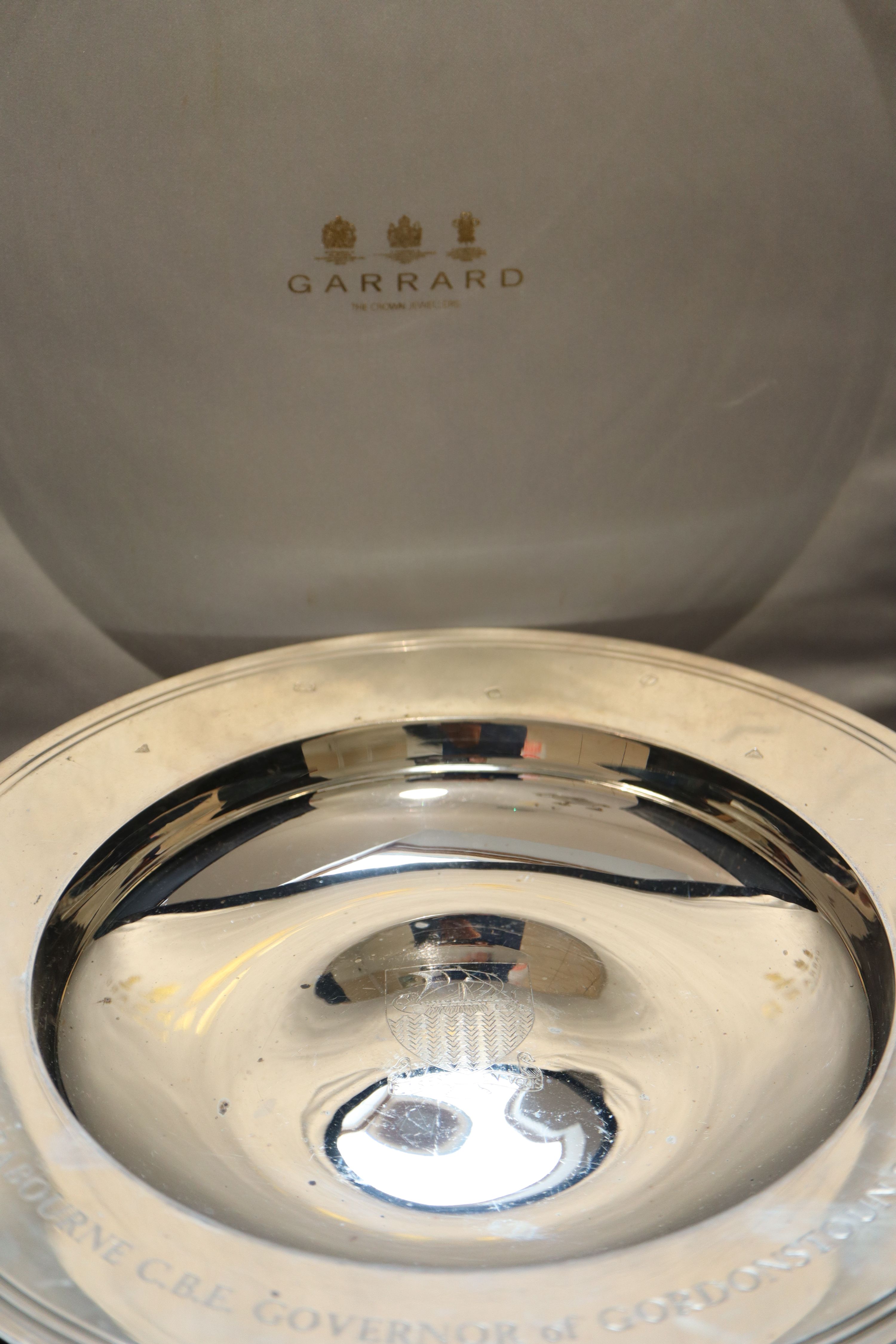 A cased modern silver Armada dish, 29.3cm, 34.5oz, in Garrards presentation case.